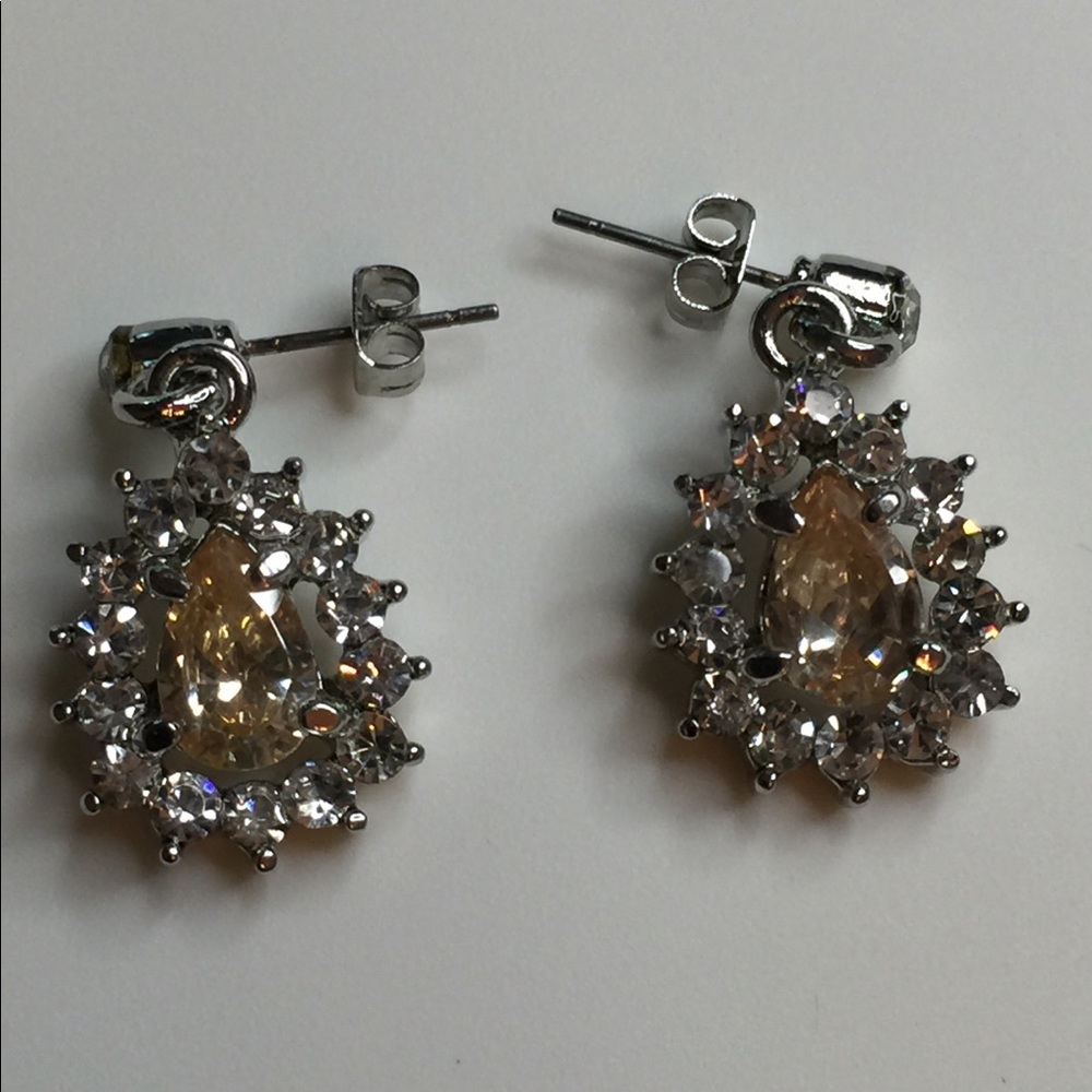Earrings.  Teardrop Faceted Citrine Gem surrounded by Rhinestones. Silvers tone